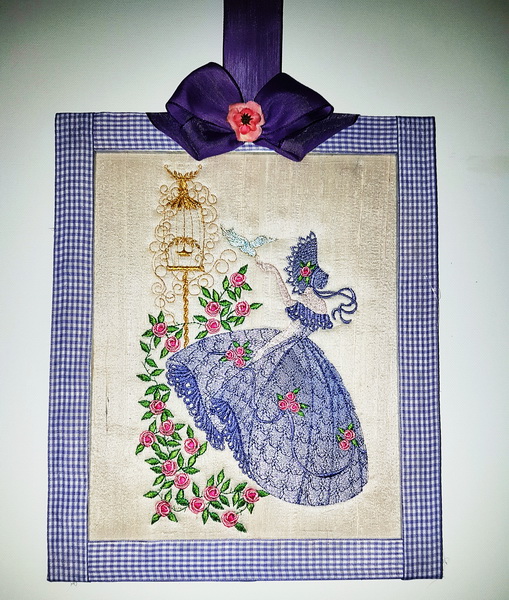 Crinoline Lady Machine Embroidery Designs by Stitchingart. Embroidered picture of lady with old fashioned dress and bonnet holding birds and roses