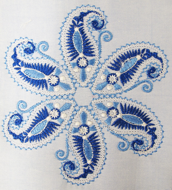 Blue Crush Machine Embroidery Designs by Stitchingart. Artistic decorative blue and white cushion.