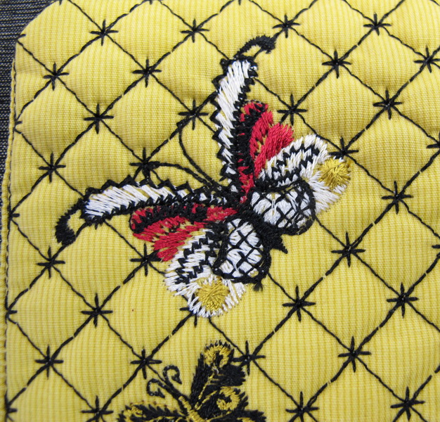 Earth Dance Machine Embroidery Designs. Butterfly, love hears, floral and flower mug rug. Pretty machine embroidery design. Great use of decorative stitches.