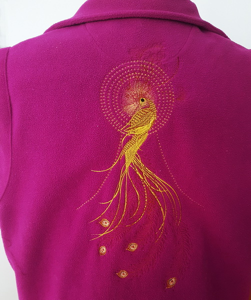 Mayil Machine Embroidery Designs by Stitchingart. Peacock design on the back of a sweater jumper.