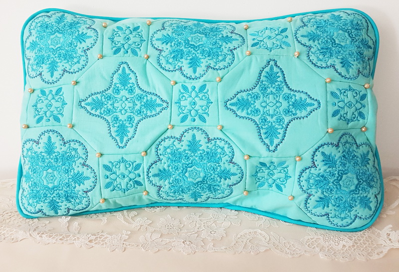 Panache Machine Embroidery Designs by Stitchingart. Aqua floral pretty decorative cushion.